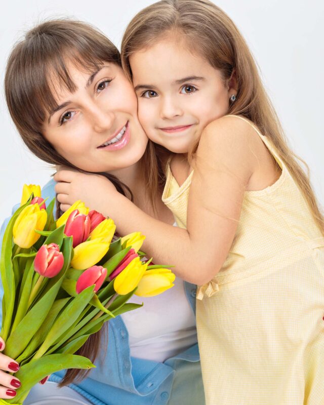 Picture of mother and daughter with flowers. Mother day concept